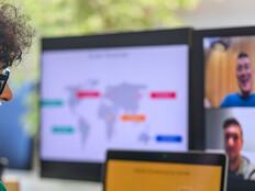 Businessperson with colleagues during conference call