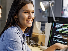 Programmer talking with coworker