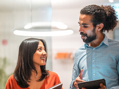 Colleagues talking at work 
