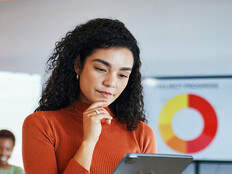 Person reviewing data via tablet