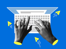 Hands typing on a computer