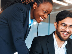 IT leaders working together in office space
