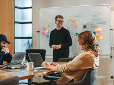 Person leading a meeting in the office