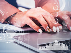 Business women typing on laptop.