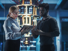 Two people in a tech facility