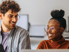 coworkers at an office collaborate