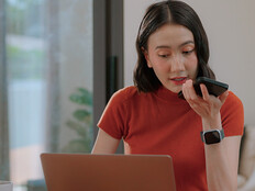 Person using phone and computer