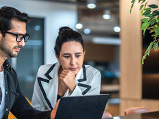 two small business owners on a laptop