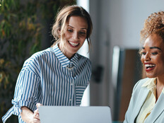 Two businesswomen viewing a laptop 