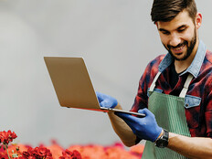 botanist uses laptop in the field
