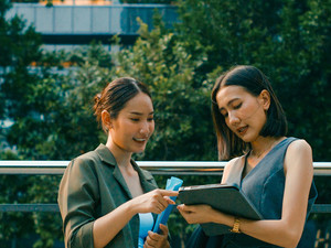 Coworkers collaborate outside of a sustainable office 