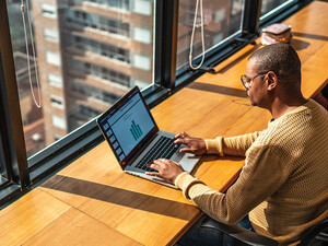 Person working in the office on a laptop