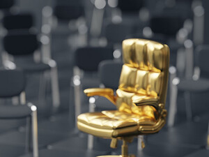 Person walking toward a gold chair