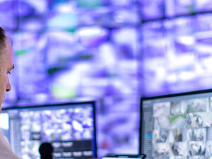 Man working in a security surveillance station