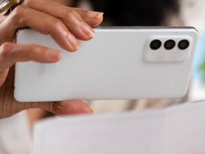 Person depositing check with cell phone