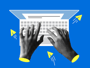 Hands typing on a computer