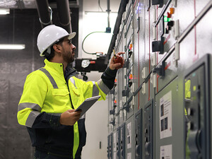 Engineers working in the main control room