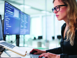 Employee reading computer screen