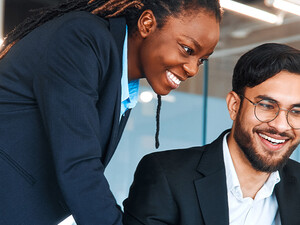 IT leaders working together in office space