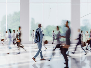 Business people walking through office building