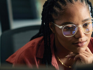 A business leader is coding