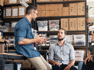 A group of colleagues having a discussion in a workshop