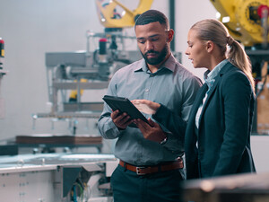 People talking in manufacturing plant