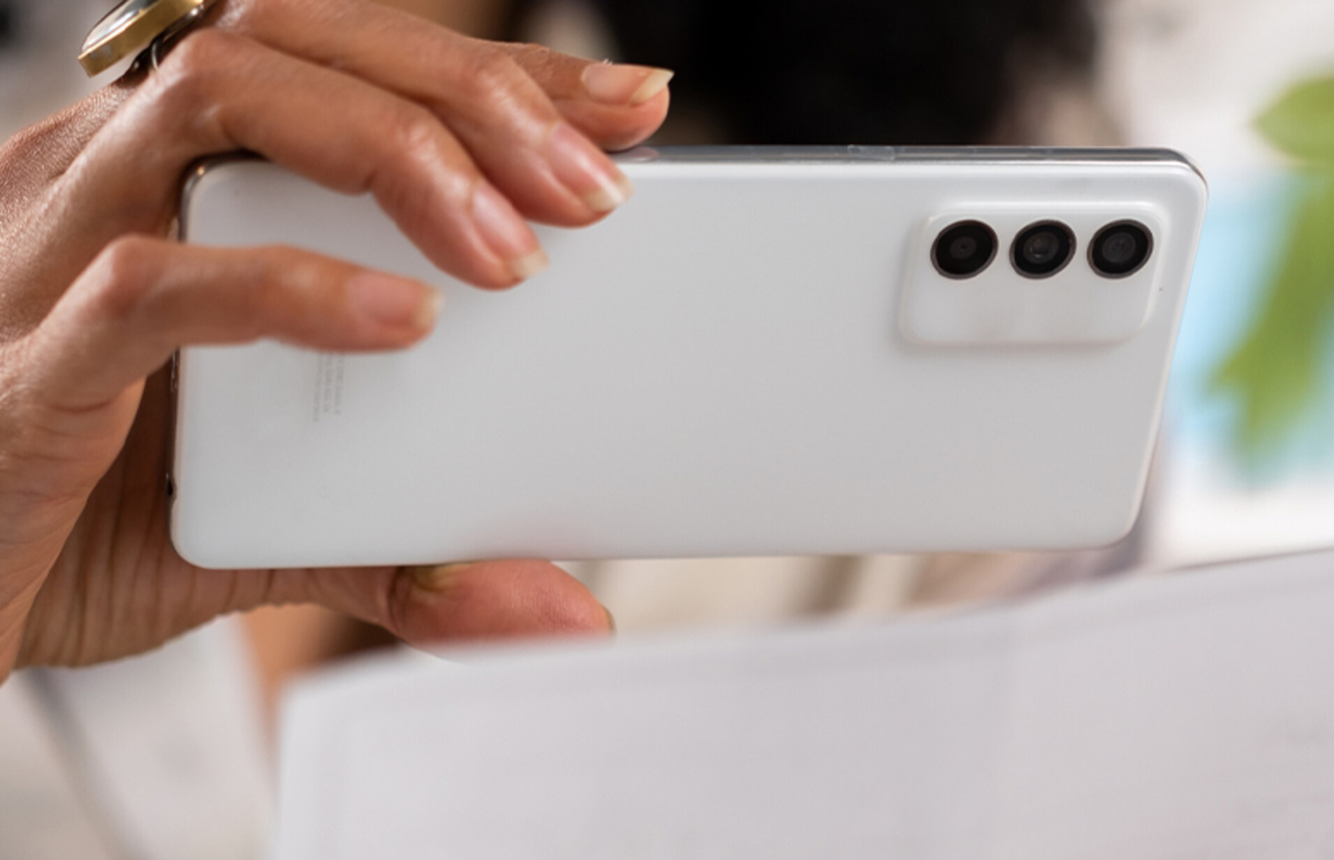 Person depositing check with cell phone
