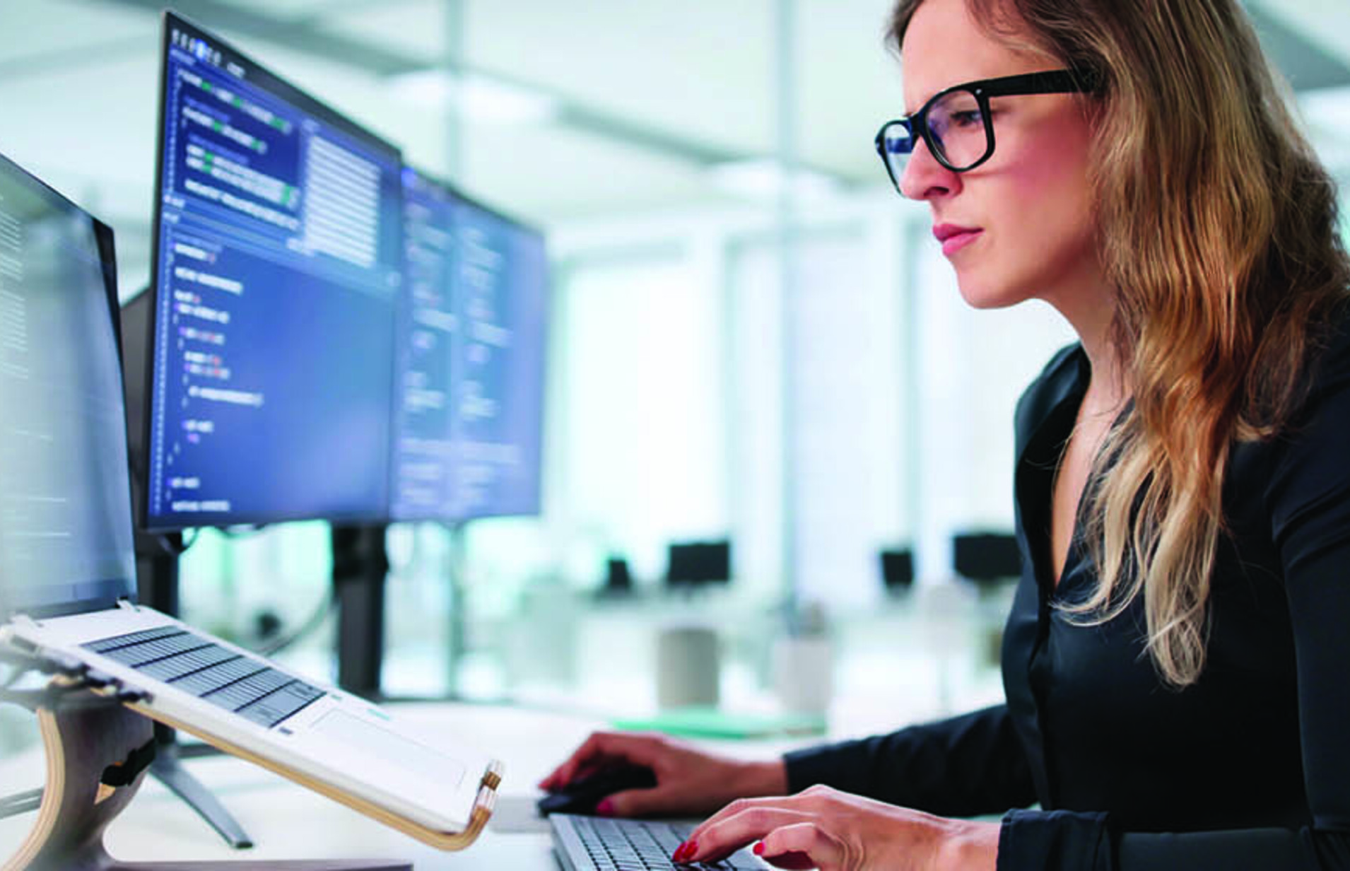 Employee reading computer screen