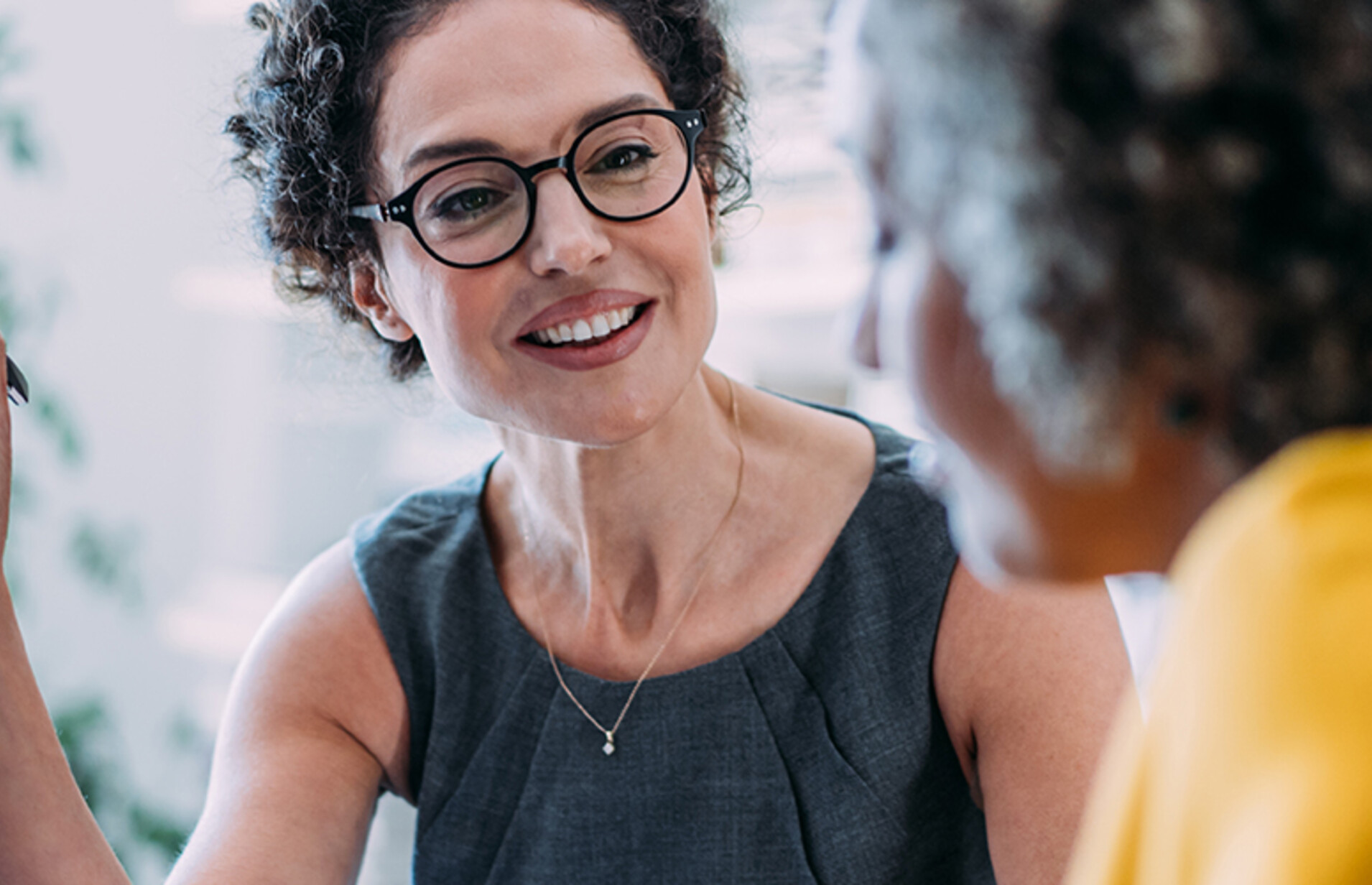 Two females talking in an office
