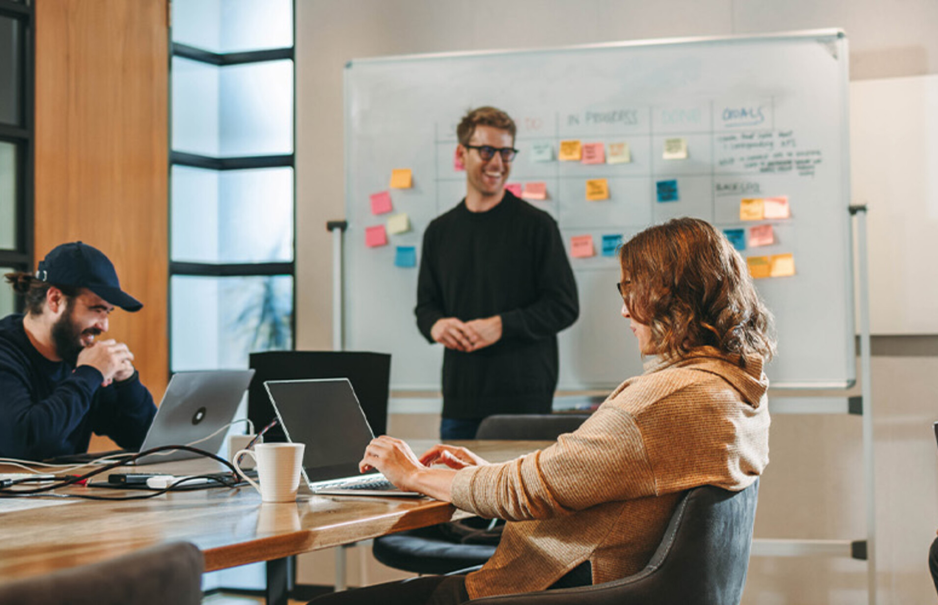 Person leading a meeting in the office