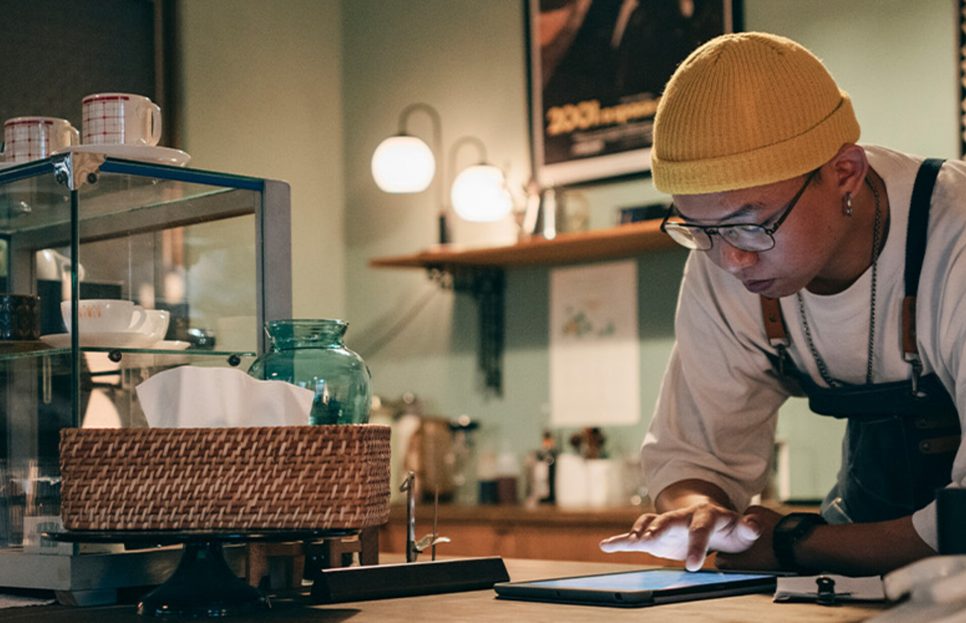 Cafe owner using technology