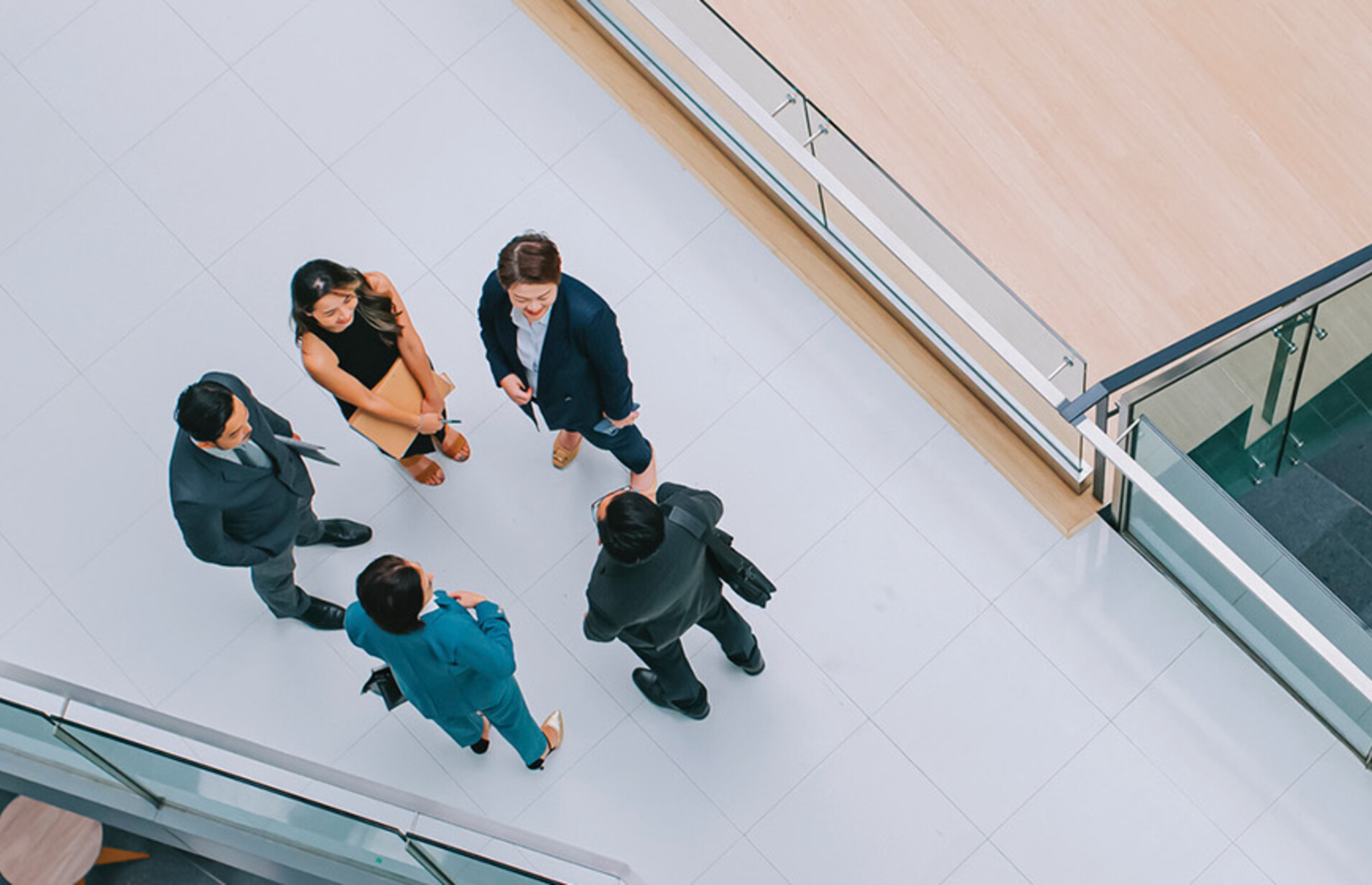 Business leaders gathered in a hallway