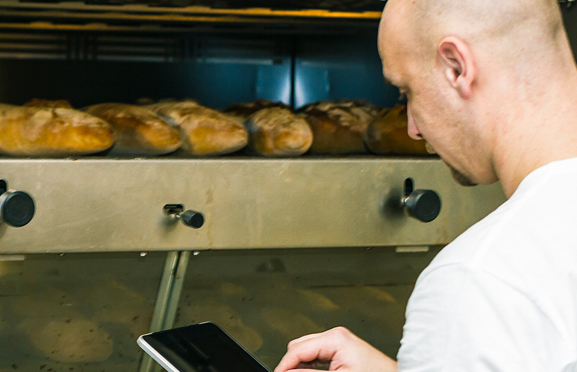 Baker using digital tablet