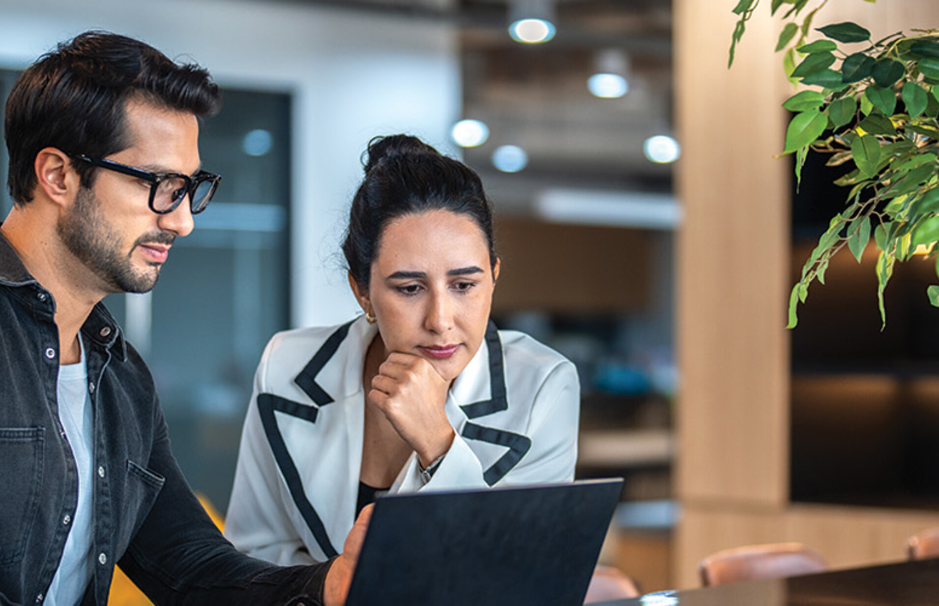 two small business owners on a laptop