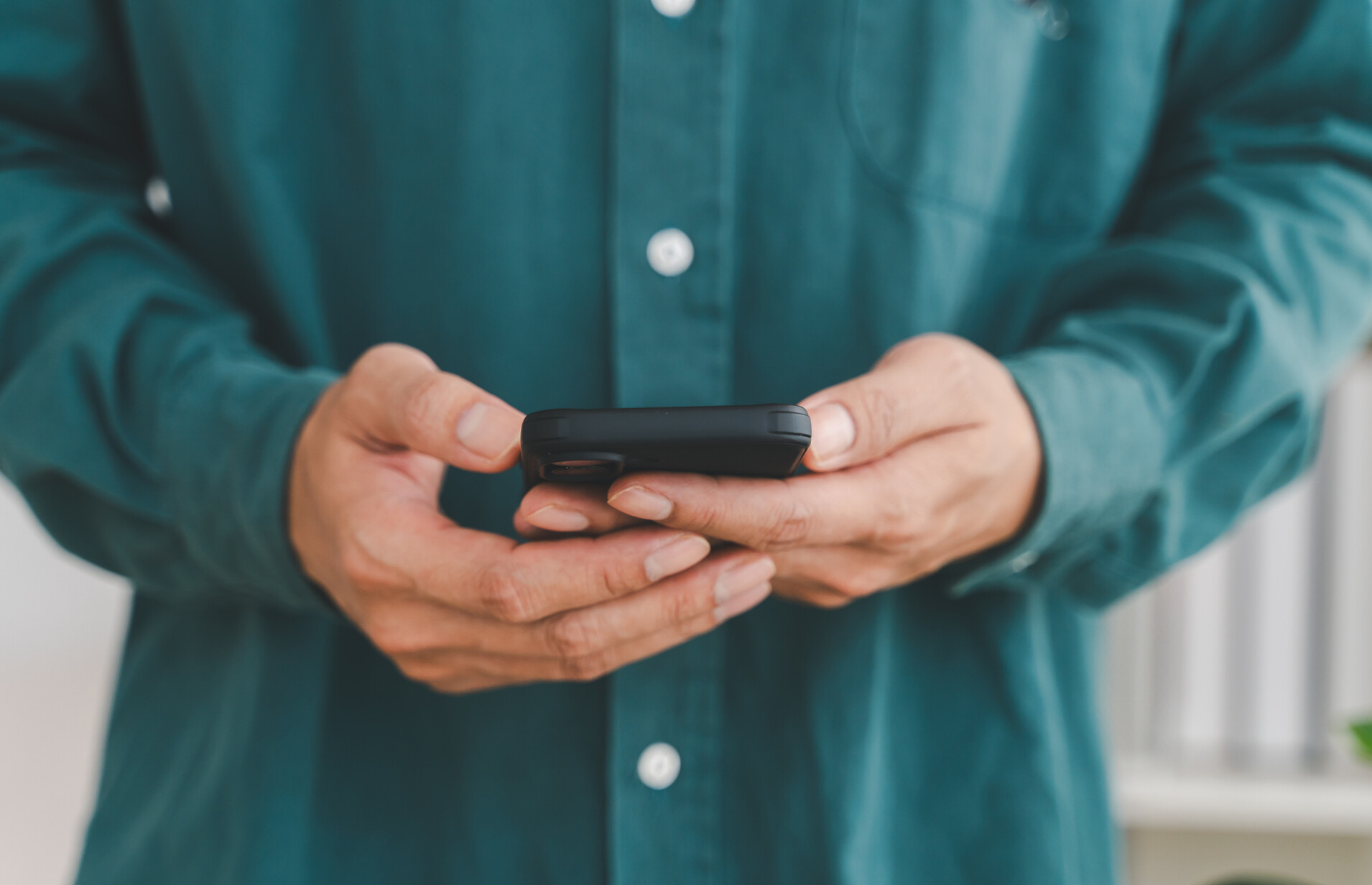 Businessman holding smartphone