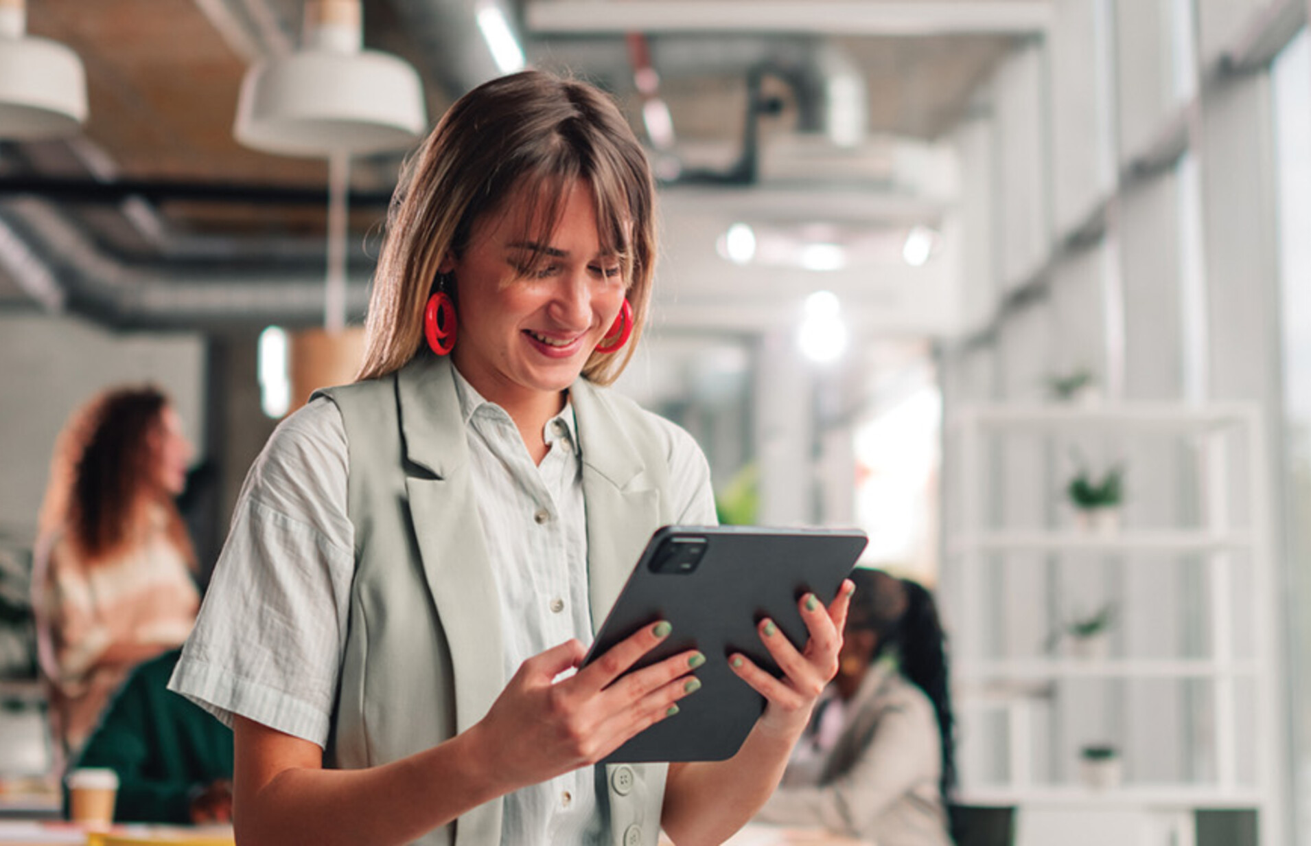 Businesswoman using tablet in modern office