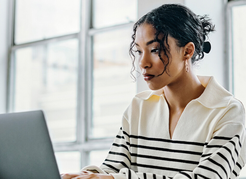 Person using laptop in the office