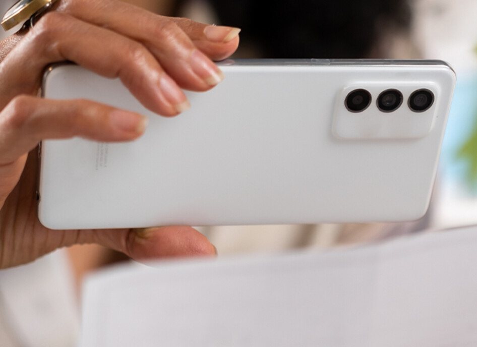 Person depositing check with cell phone