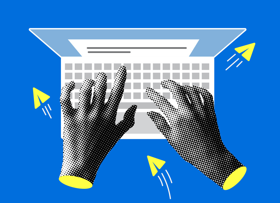 Hands typing on a computer