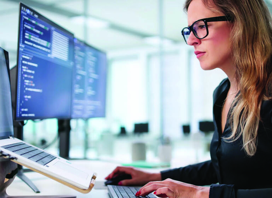 Employee reading computer screen