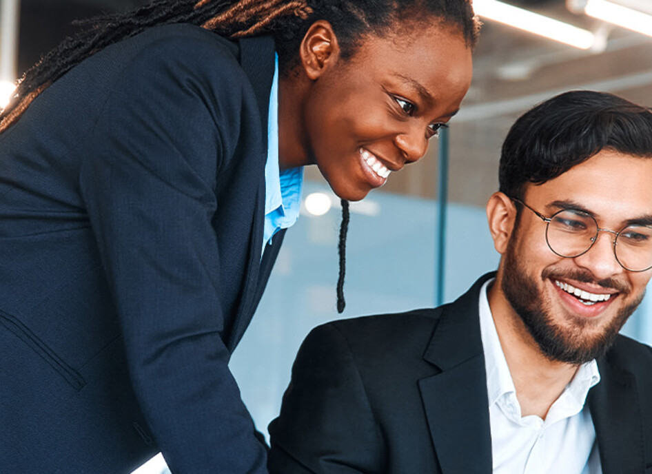 IT leaders working together in office space