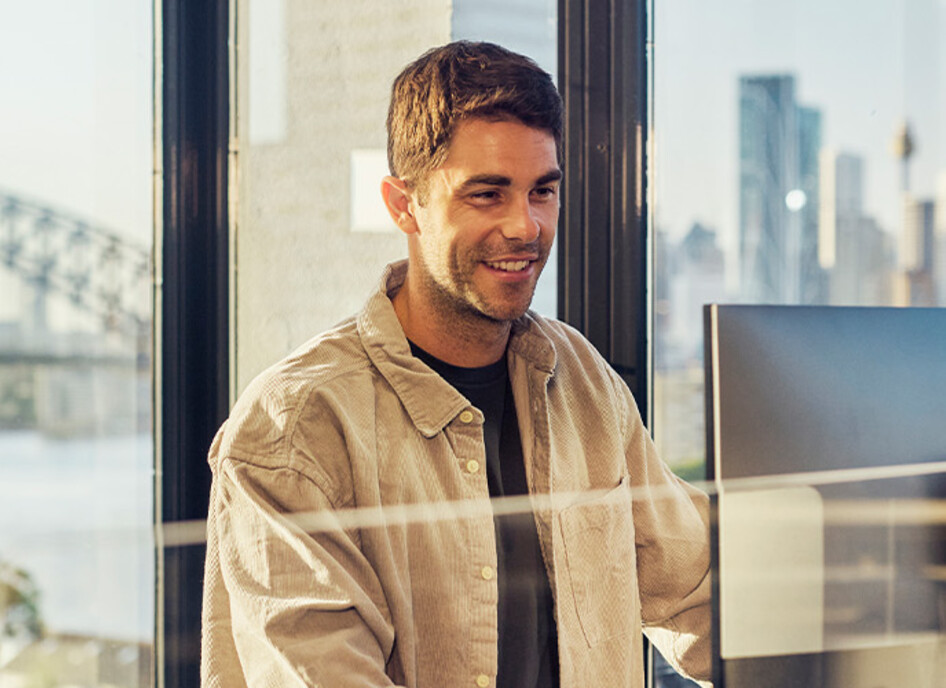 IT leader working on a large monitor display