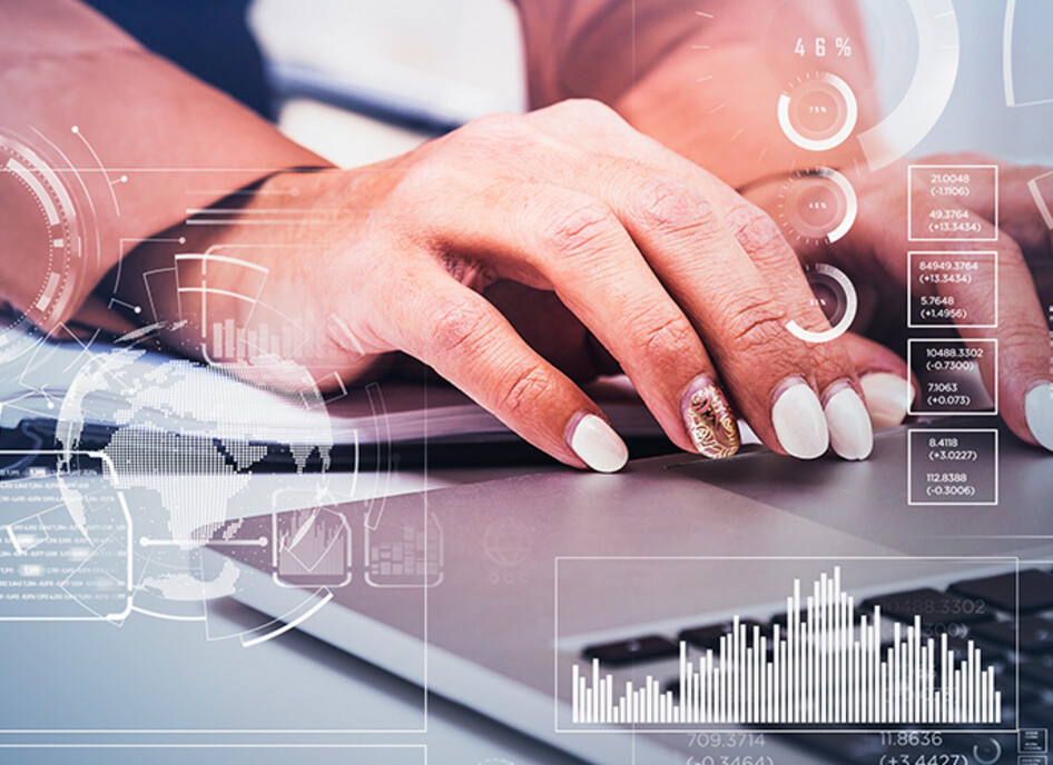 Business women typing on laptop.