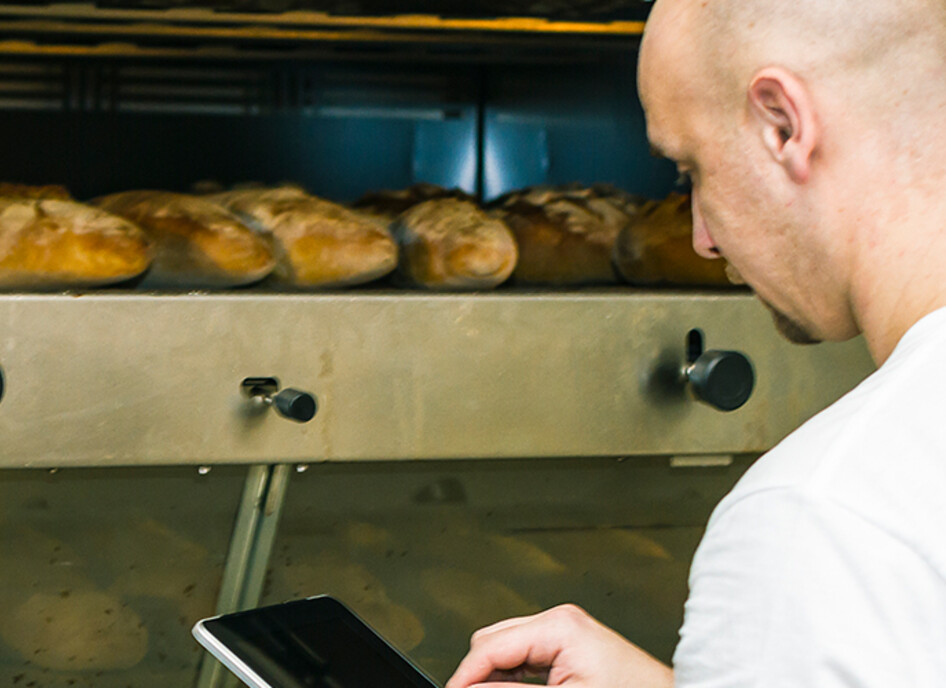 Baker using digital tablet