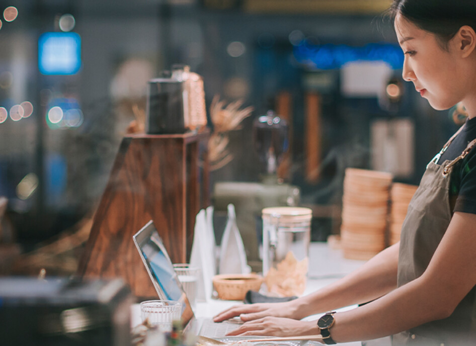 lady at counter on laptop