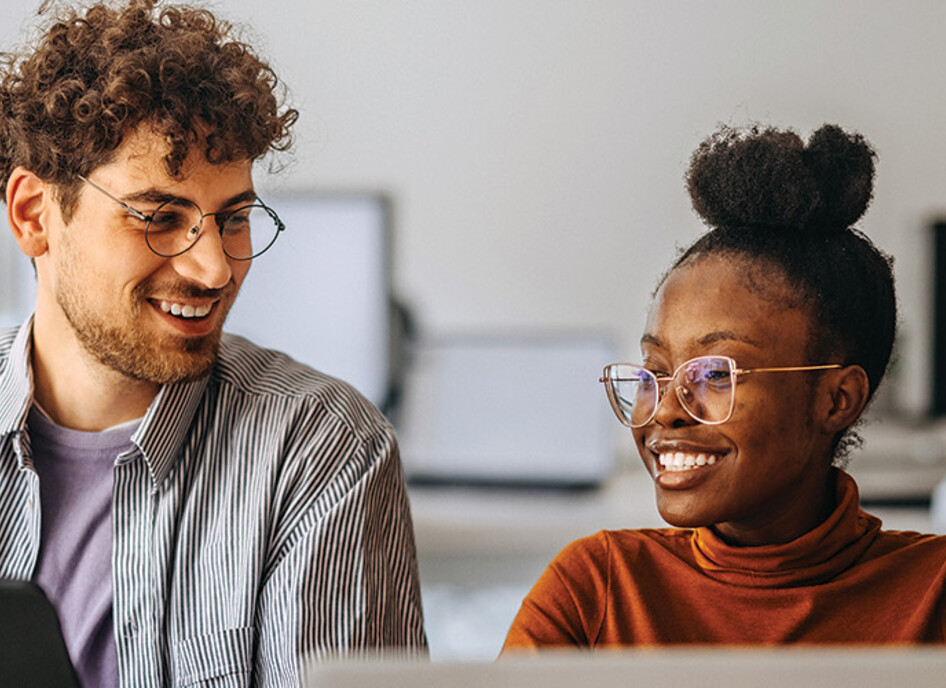 coworkers at an office collaborate