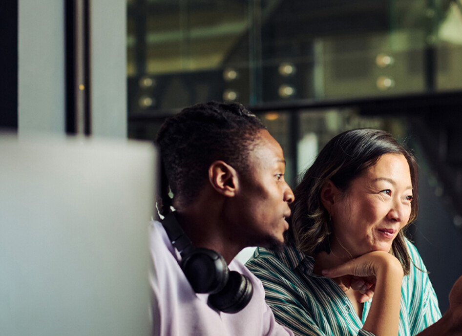 2 people at computer screens
