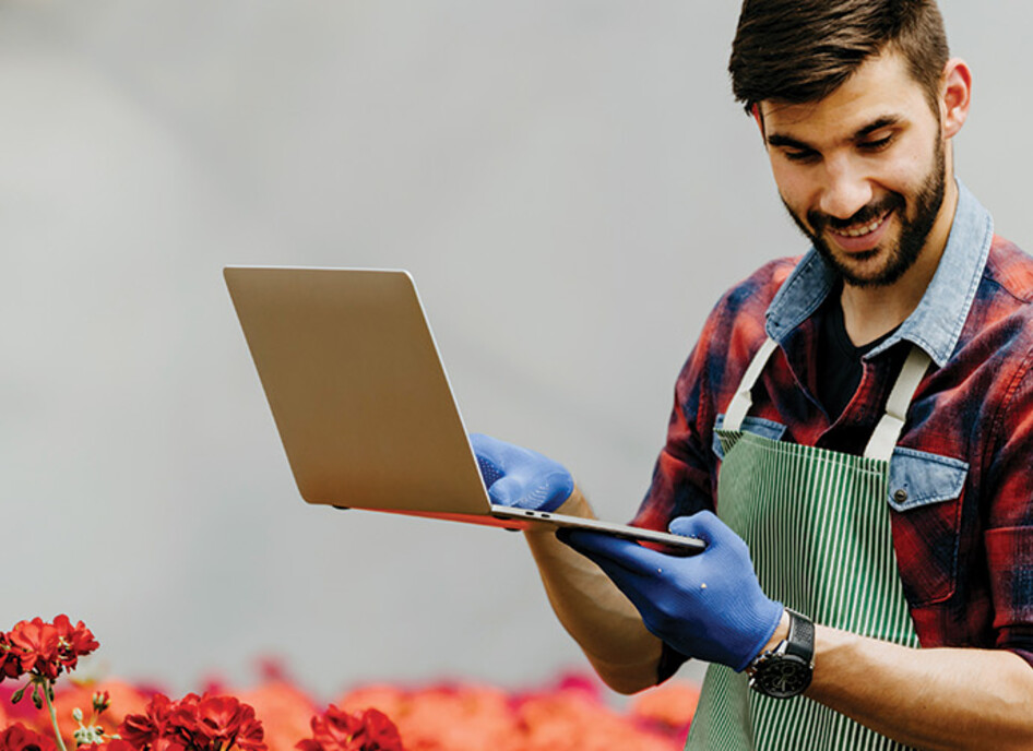 botanist uses laptop in the field
