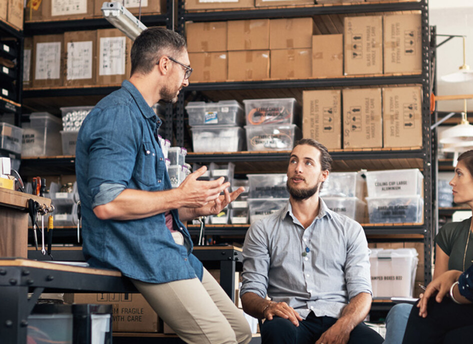 A group of colleagues having a discussion in a workshop
